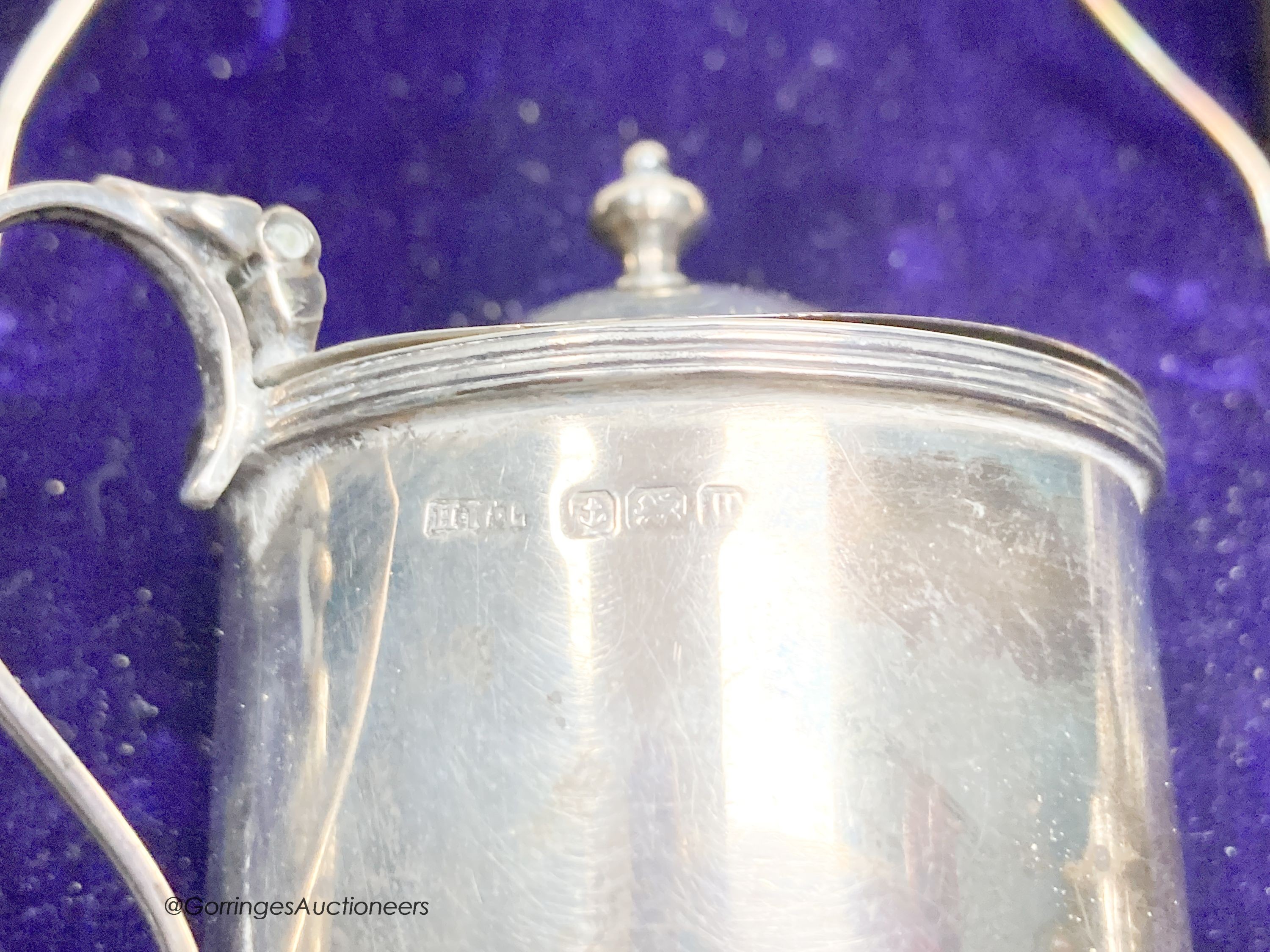 A cased George V silver five piece condiment set and two spoon, Birmingham, 1912.